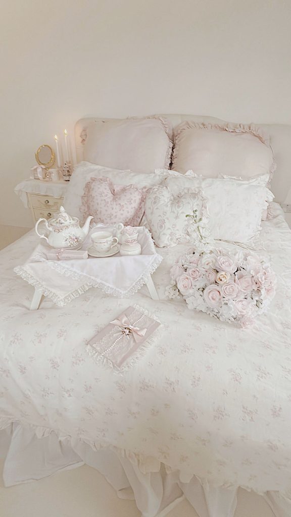 White ruffled bedding shabby chic style with pink roses and tea tray
