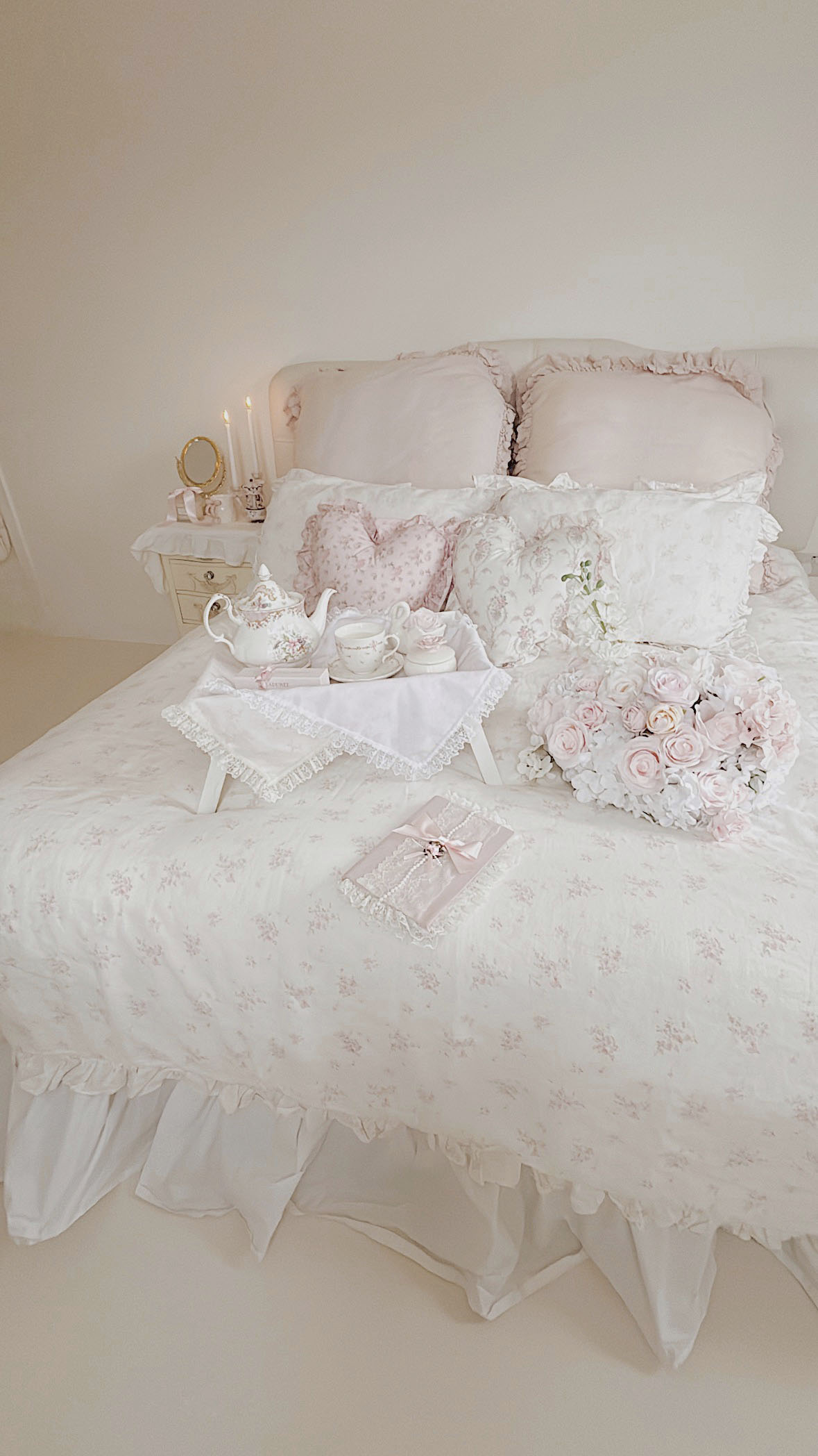 White ruffled bedding shabby chic style with pink roses and tea tray