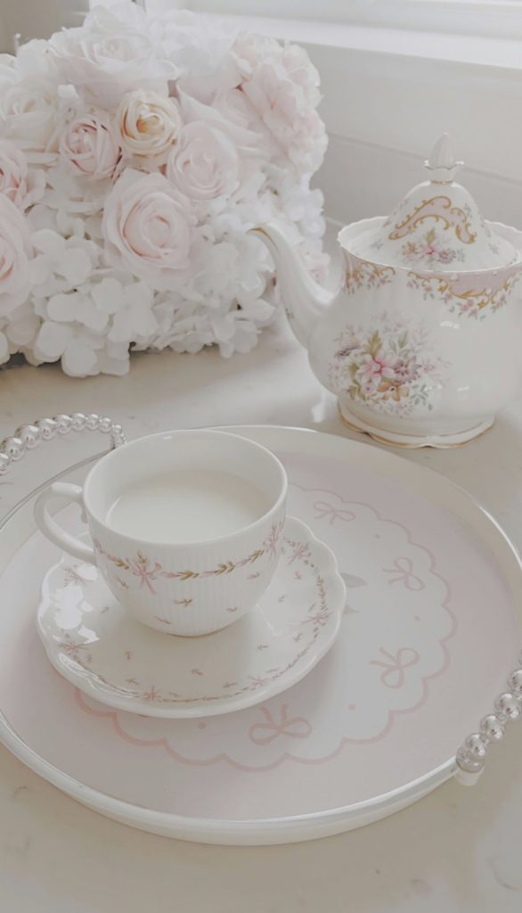 Shabby chic floral ruffled bedding with pink roses in a romantic bedroom