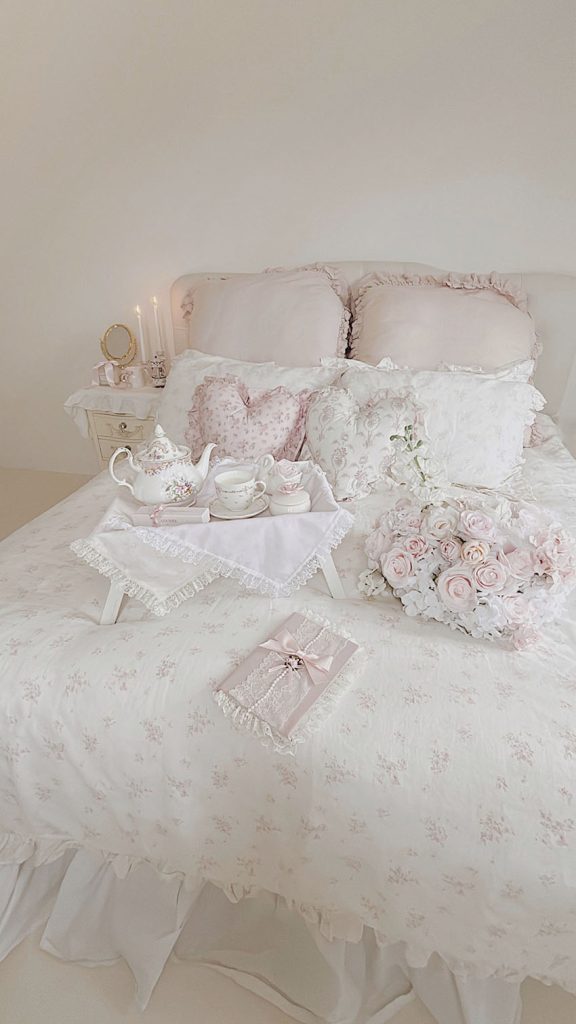White ruffled bedding shabby chic style with pink roses and tea tray